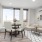 a living room with a table and chairs