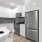 a kitchen with white cabinets