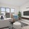 a living room with a tv and couches