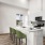a kitchen with a table and chairs