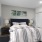 a bedroom with a bed and lamps