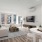 a living room with a large window and couch