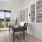 a room with a table and windows