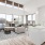 a large living room with large windows