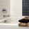 a bathtub with a white and black tiles