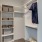 a closet with clothes